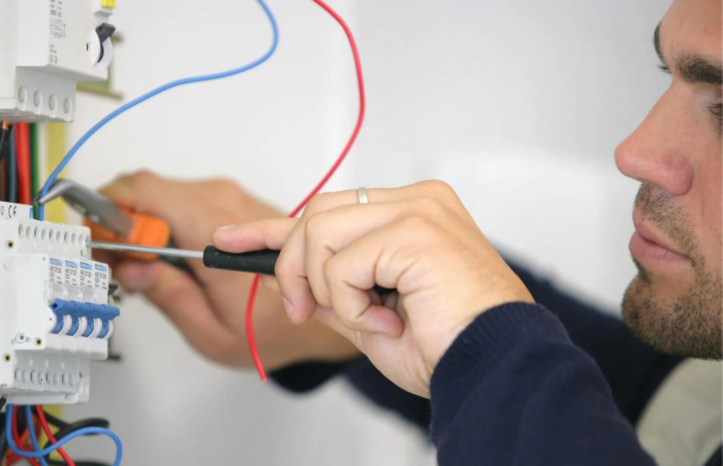 Electrician working on a consumer unit